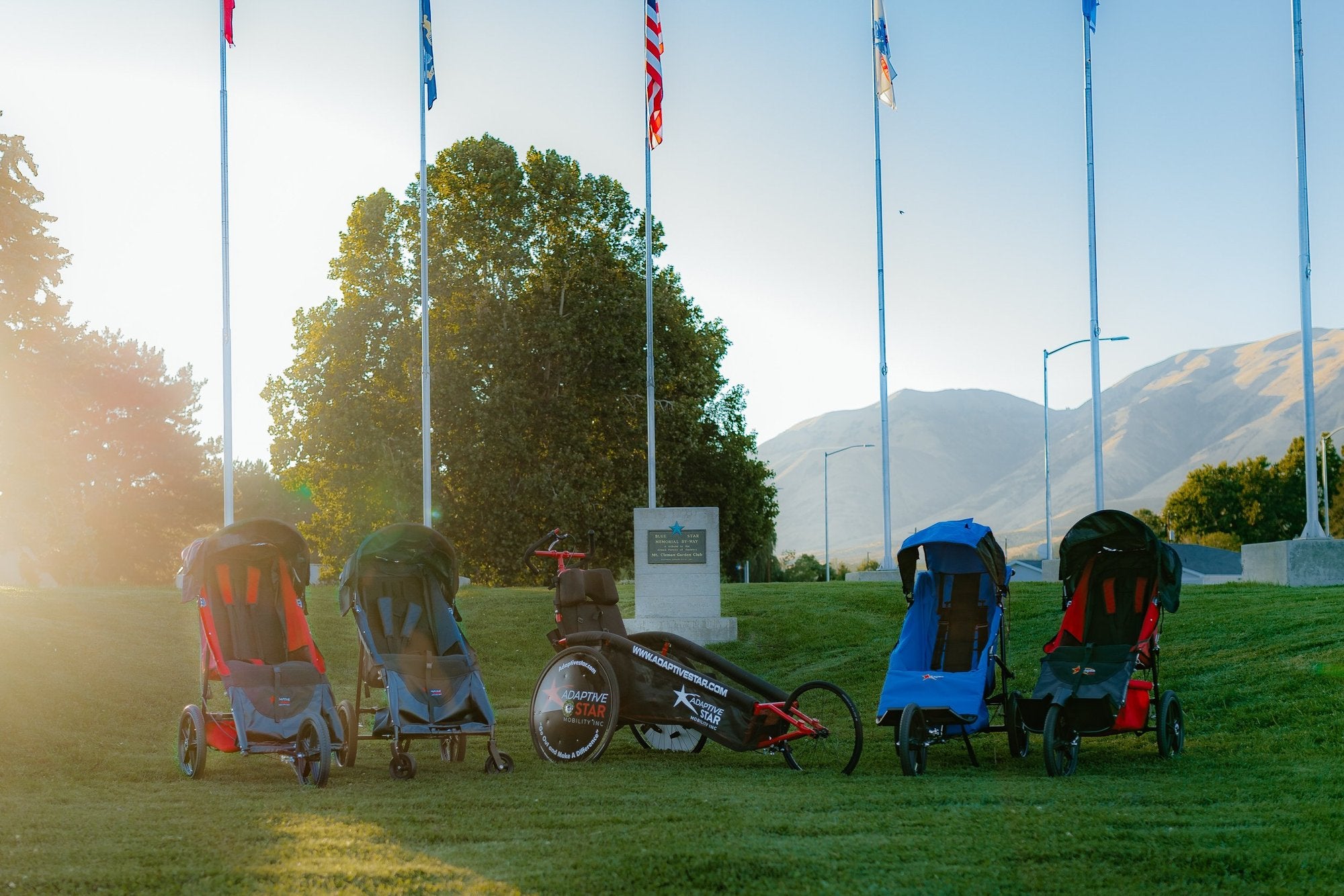A child in an adaptive chair out with their family