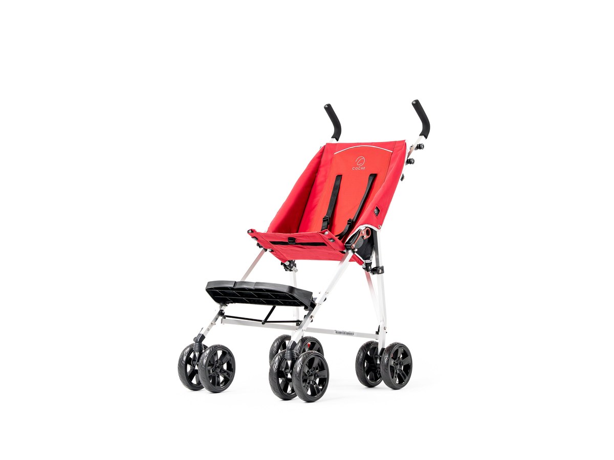 A parent folding a lightweight adaptive chair beside a car