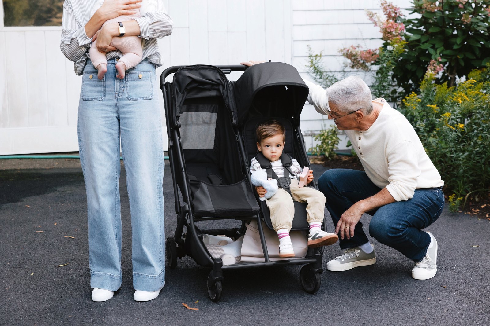 Family out together with an UPPAbaby double stroller