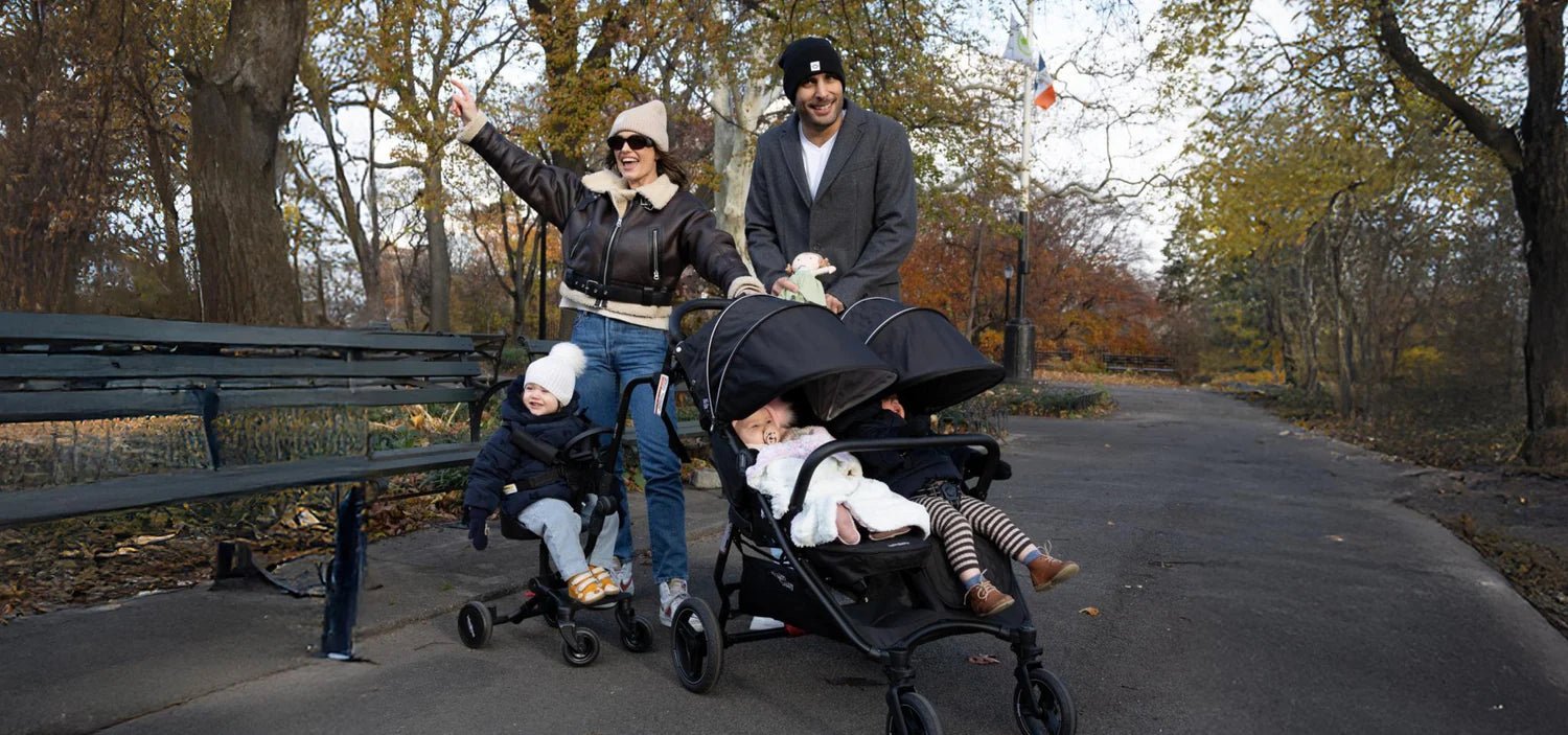 Mother and toddler out in the city with a Valco Baby stroller