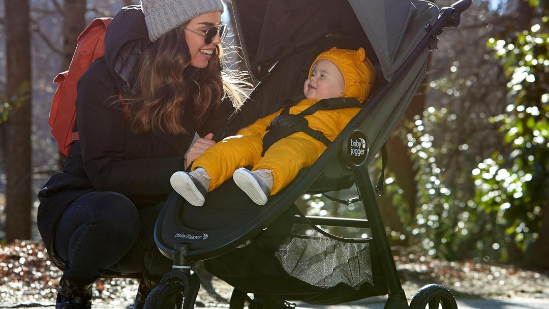 Parent with child in stroller outdoors