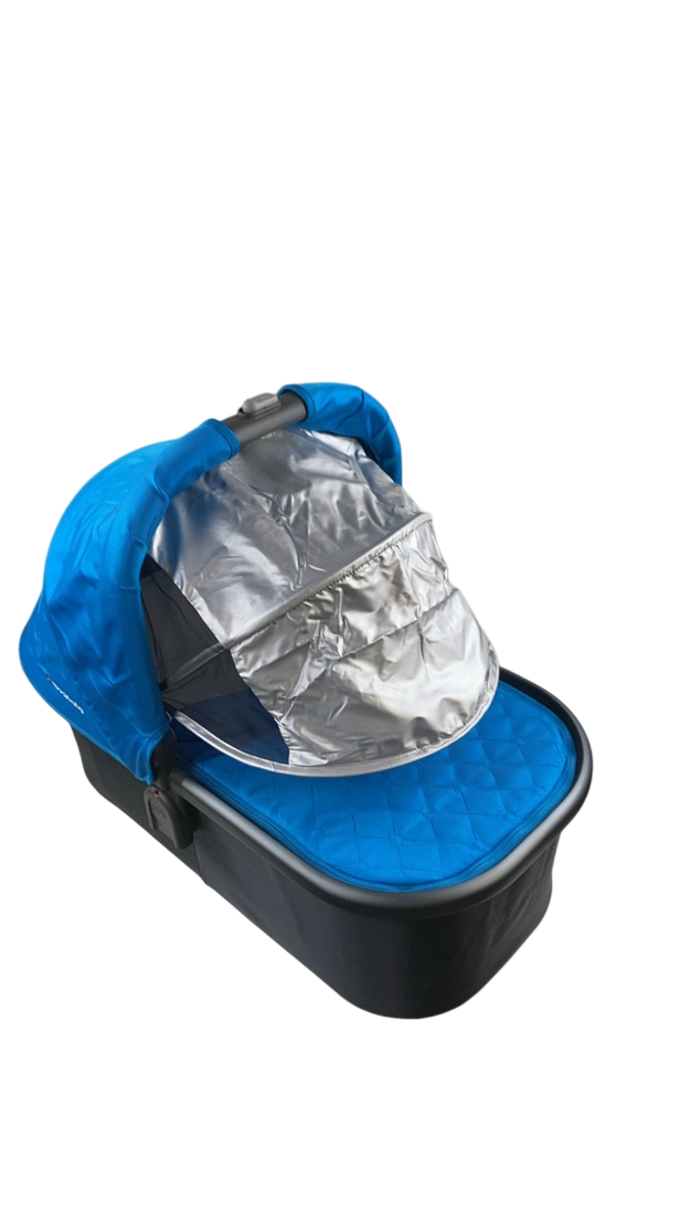 Reference product photo: UPPAbaby 2015 Bassinet, Georgie Marine Blue — extended sunshade view.