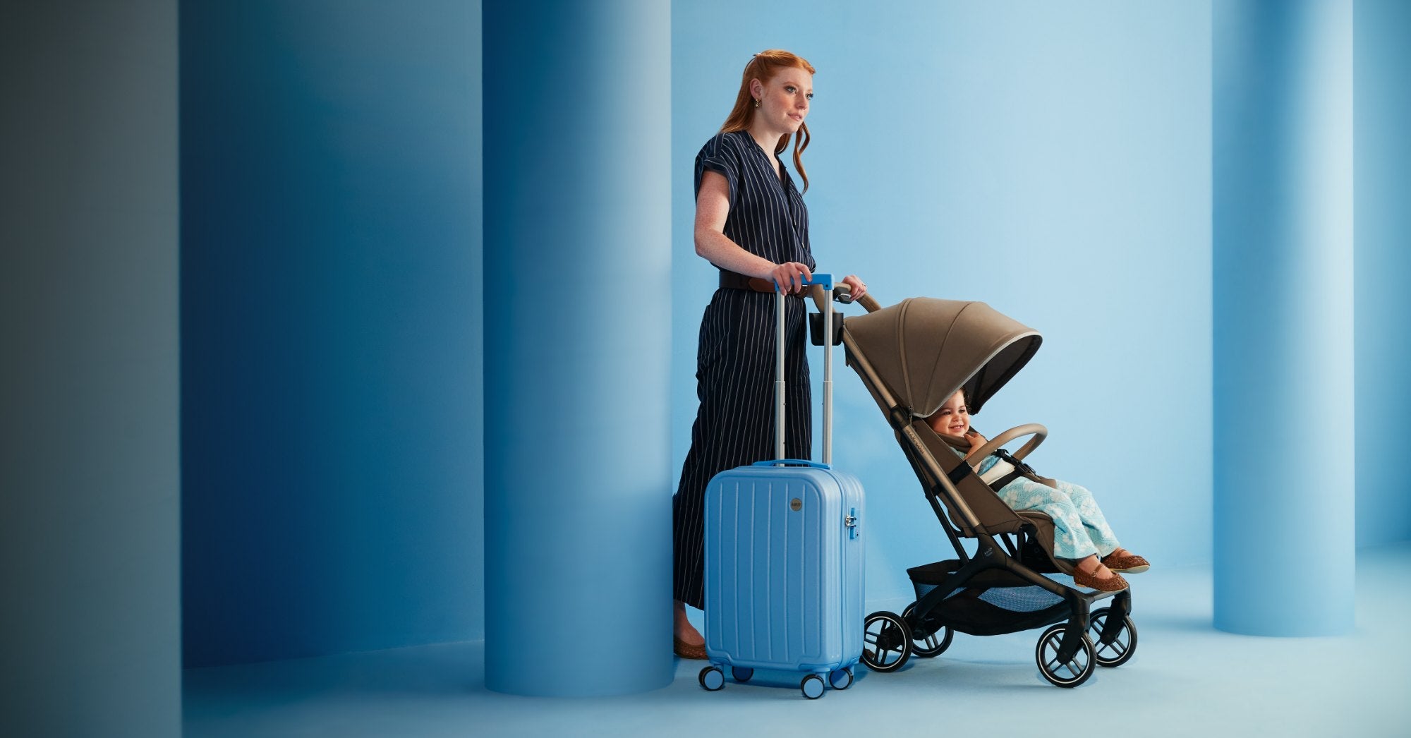 Maxi-Cosi travel stroller with parent and child