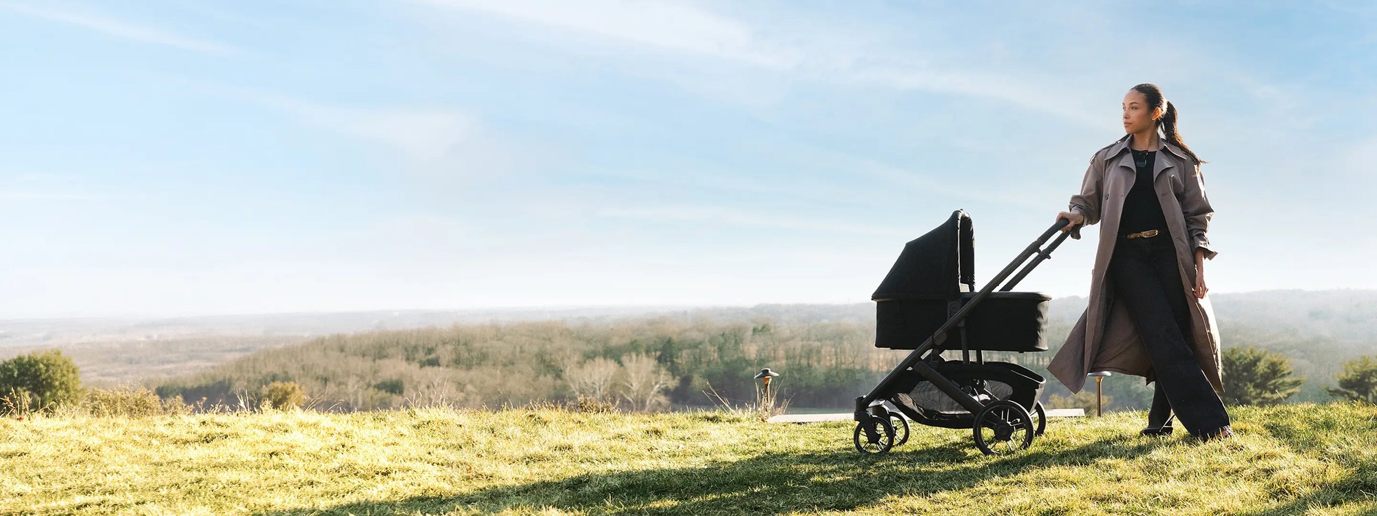 Parent strolling with an UPPAbaby bassinet stroller