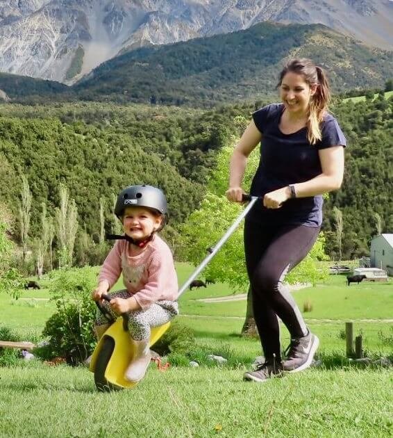 Child riding a Mountain Buggy unirider outdoors